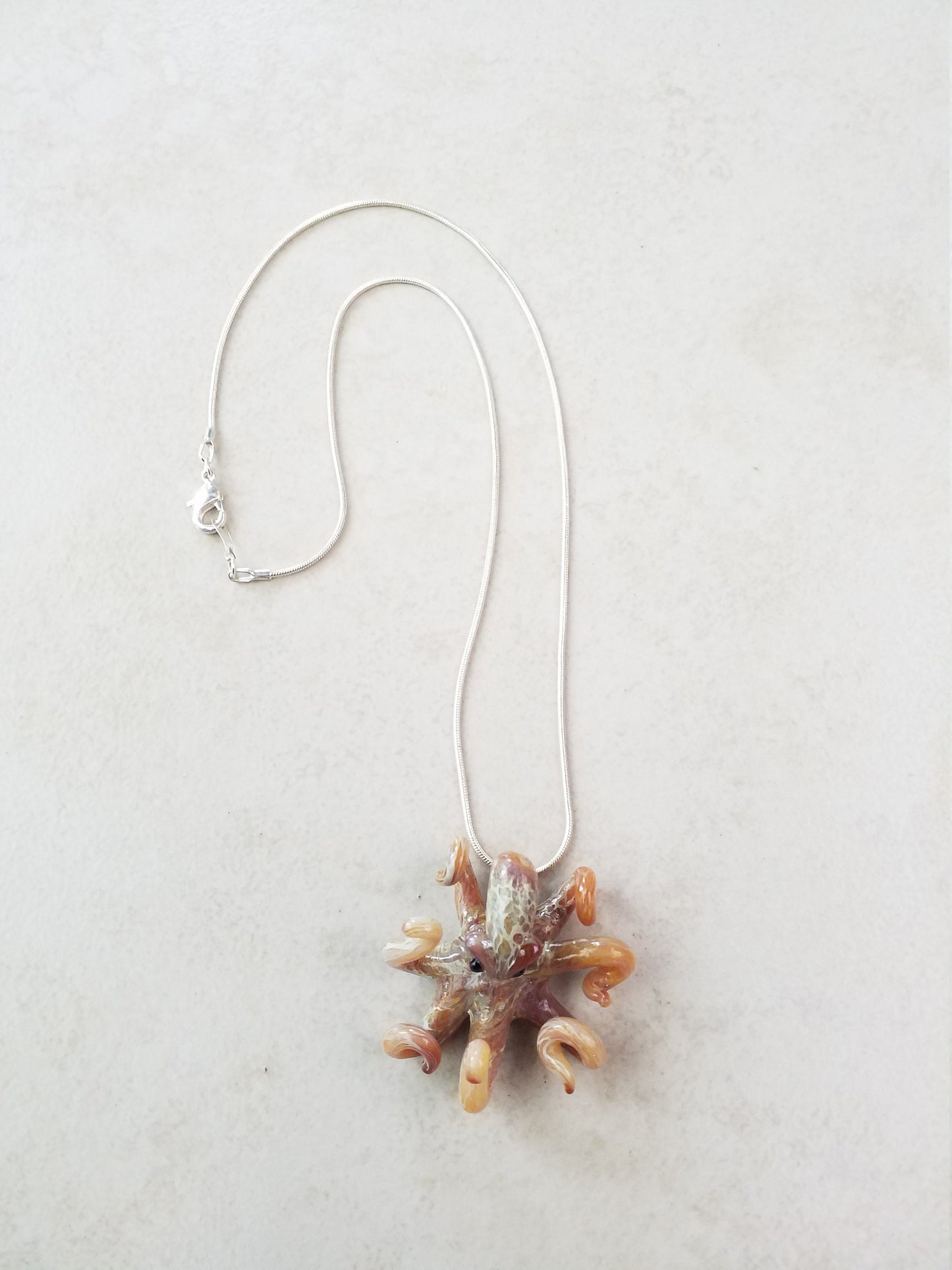 Pacific Octopus Pendant Necklace with multiple colors of Carmel and Brown a Great Gift Idea for Him or Her