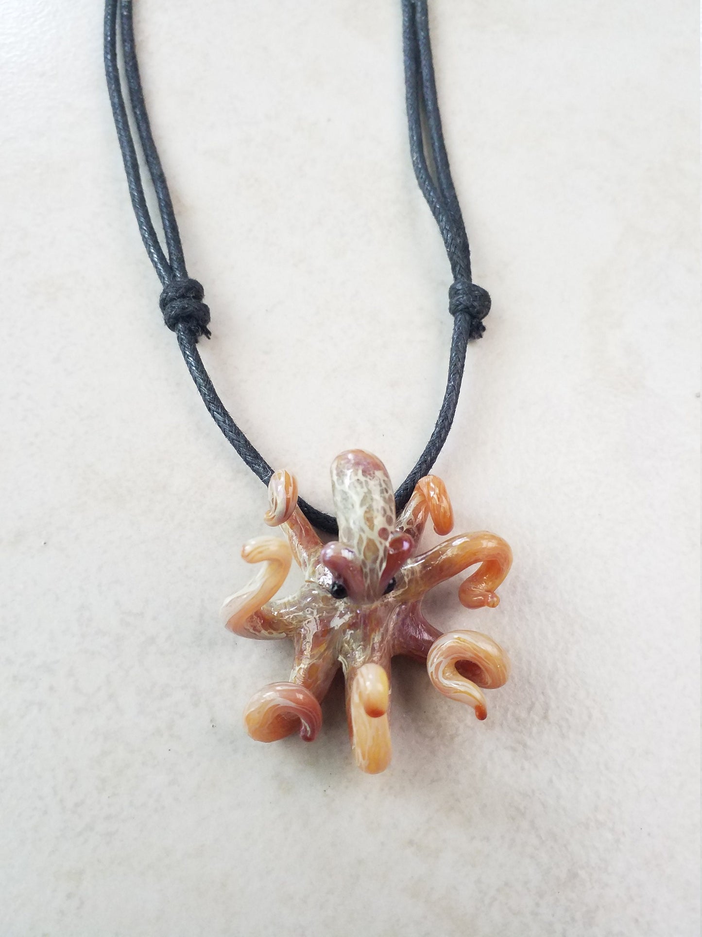 Pacific Octopus Pendant Necklace with multiple colors of Carmel and Brown a Great Gift Idea for Him or Her