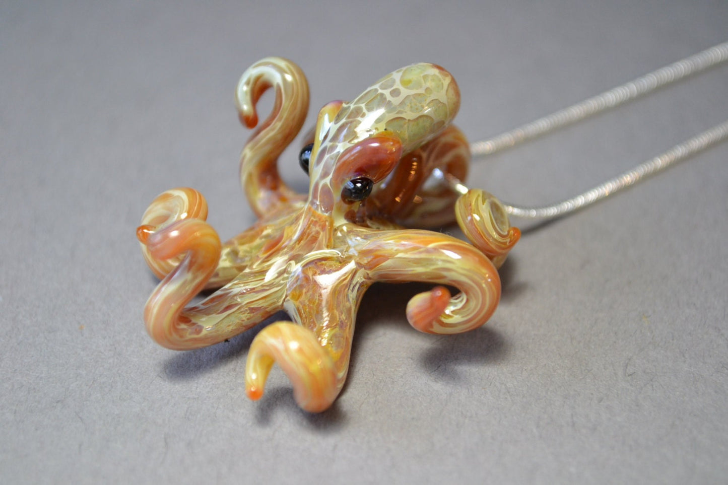 Pacific Octopus Pendant Necklace with multiple colors of Carmel and Brown a Great Gift Idea for Him or Her