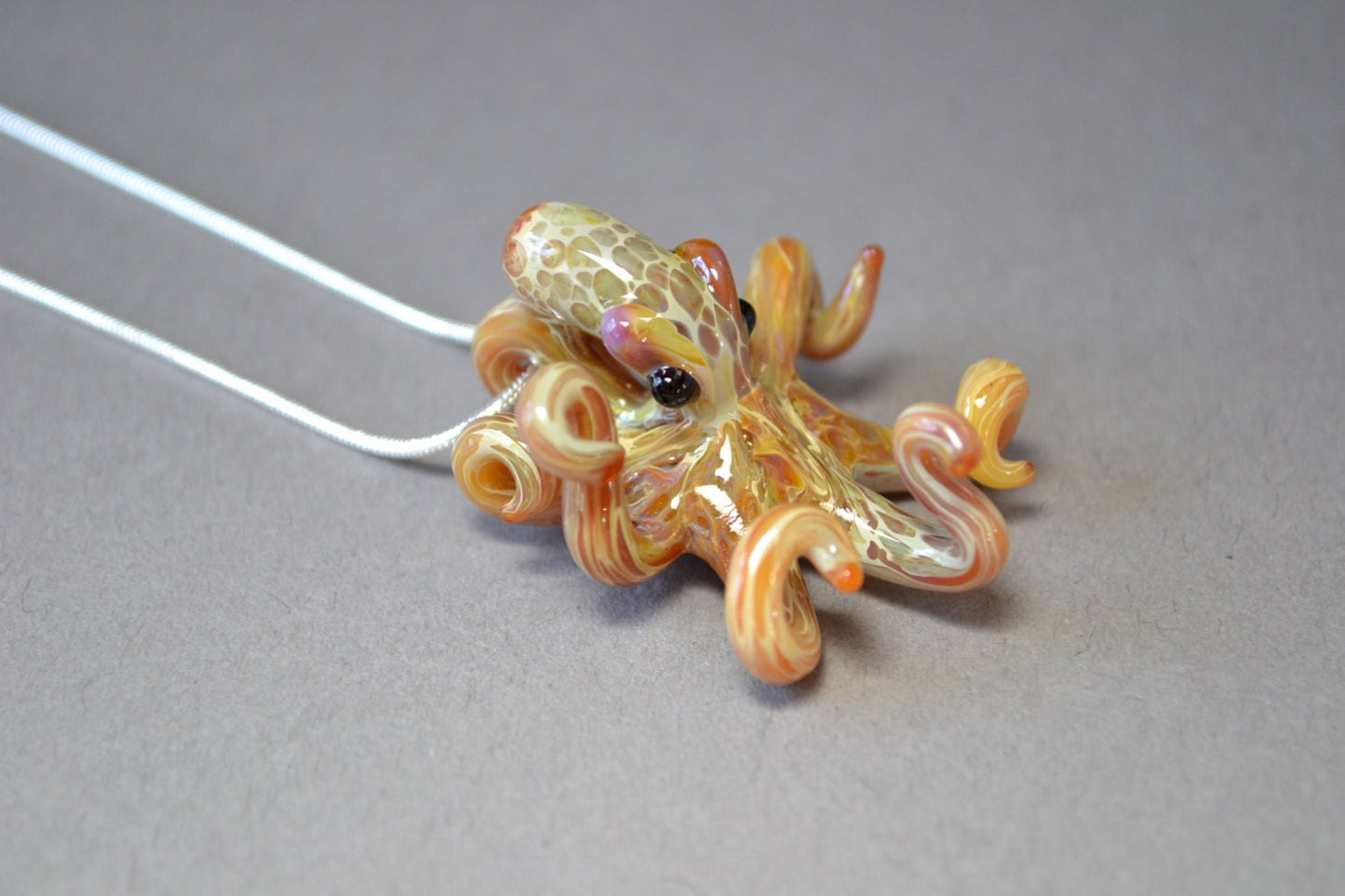 Pacific Octopus Pendant Necklace with multiple colors of Carmel and Brown a Great Gift Idea for Him or Her