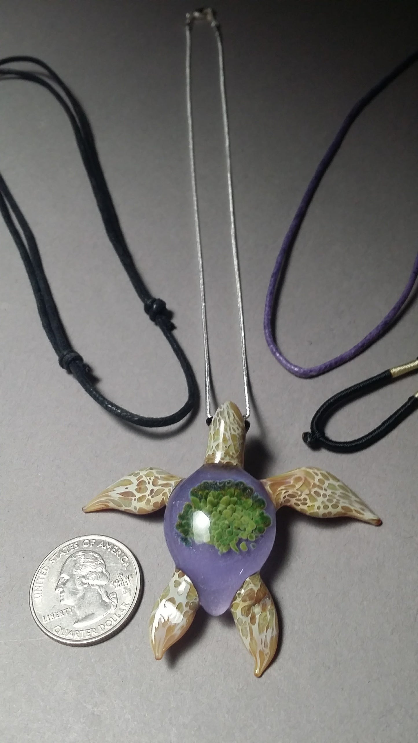 Special edition periwinkle background with green anemones in a beach blonde glass sea turtle pendant