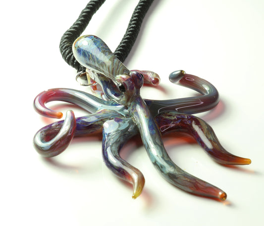 Purple glass spreading octopus pendant