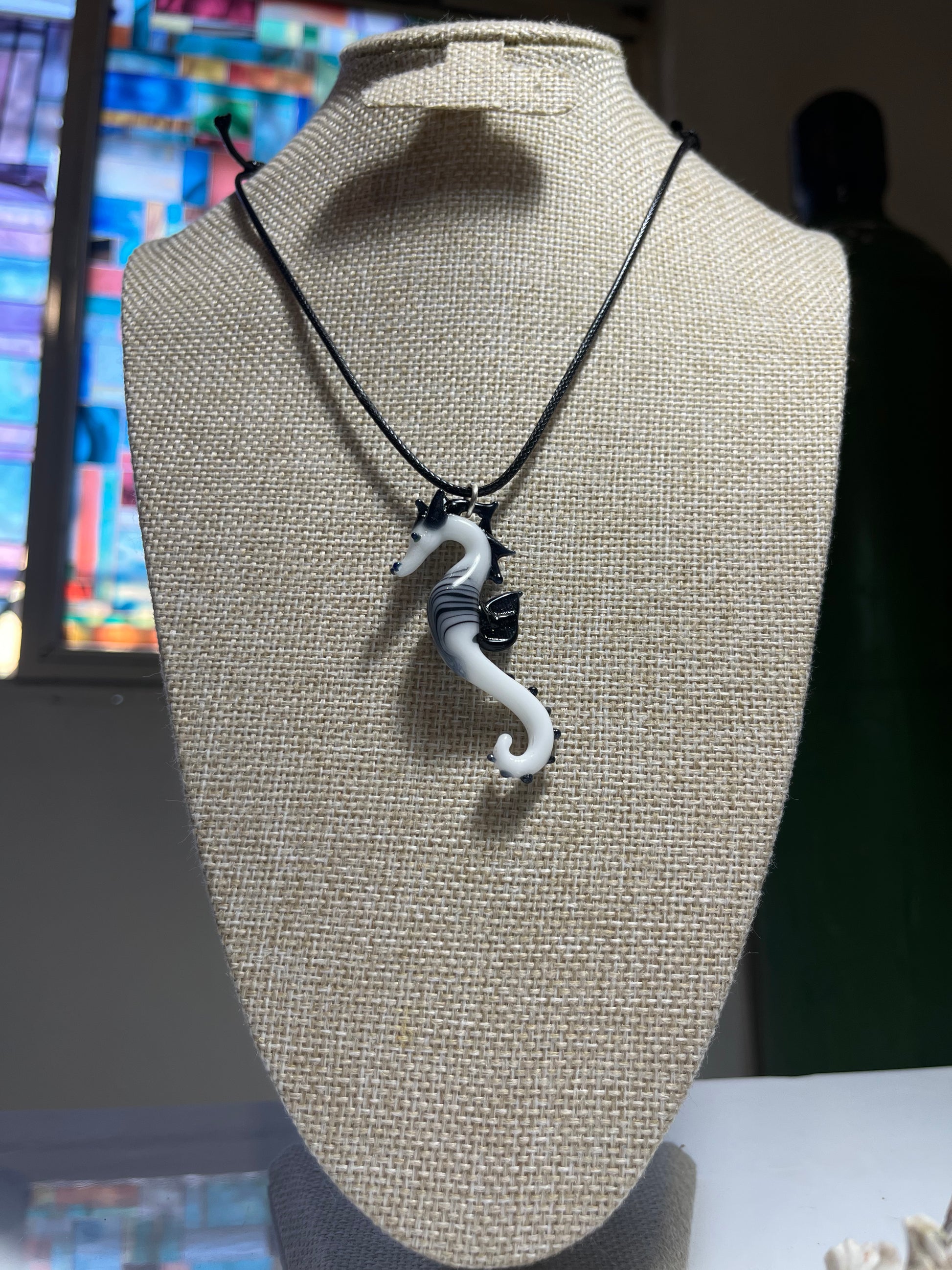 Sea Horse Splendor: Hand-Blown Black and White Glass Pendant - GLASSnFIRE